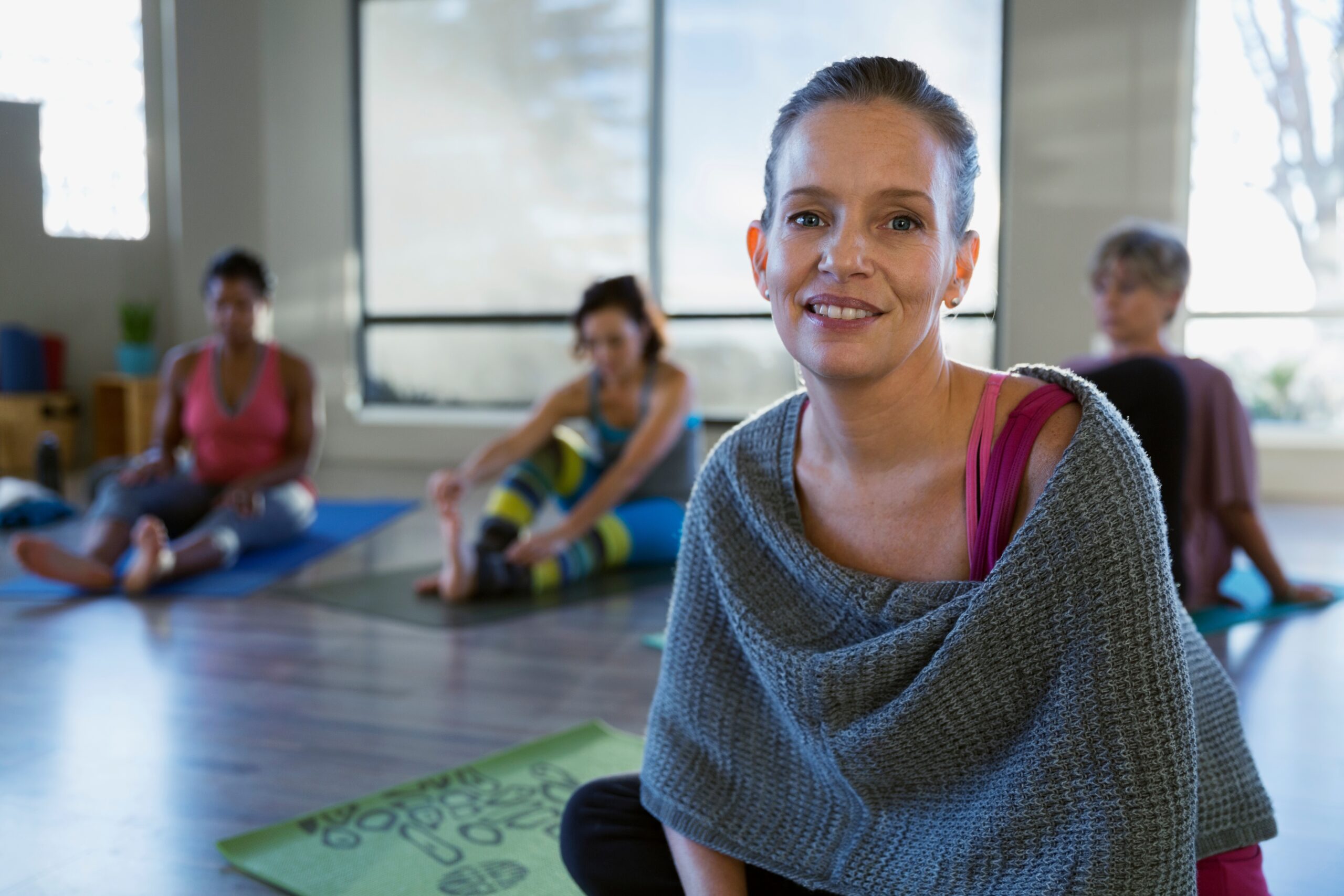 Person practising yoga as part of an integrative oncology support program at a cancer wellness centre