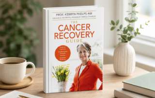 The Cancer Recovery Guide by Professor Kerryn Phelps AM book cover, featuring the author in a red blazer with daffodils and a coffee cup.